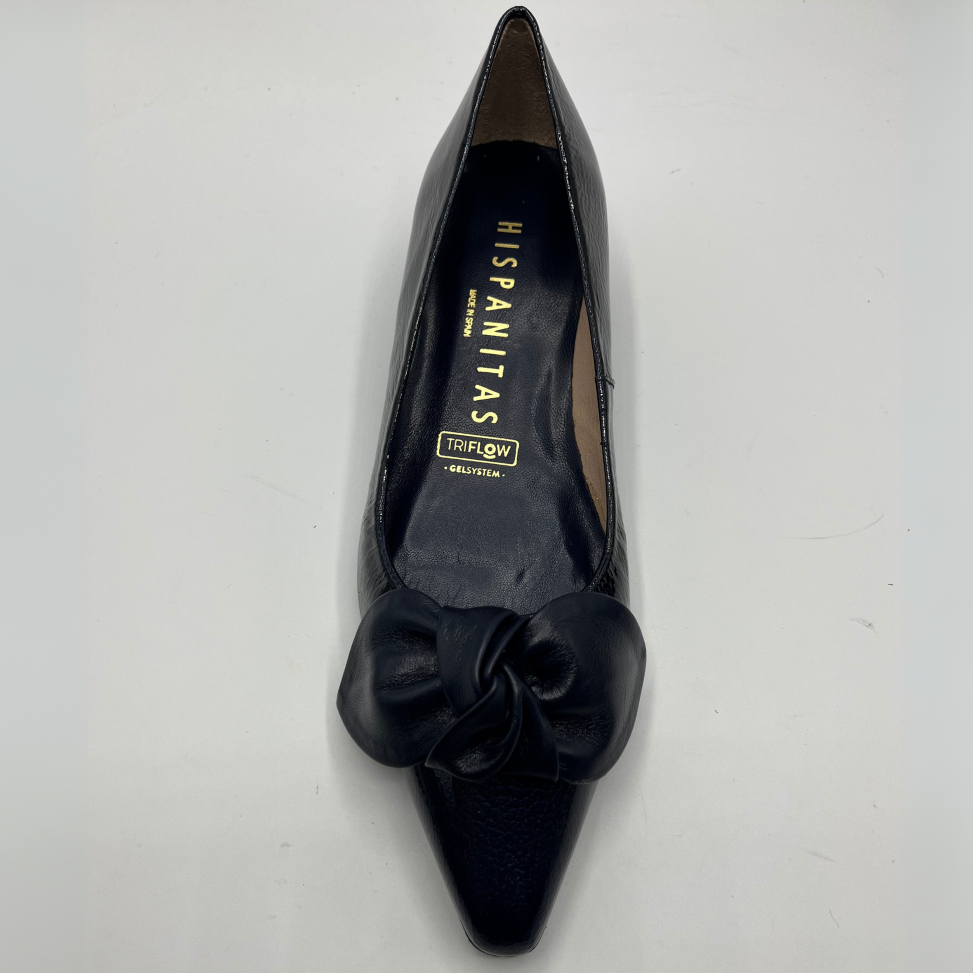 Navy shoe with a bow on a white background