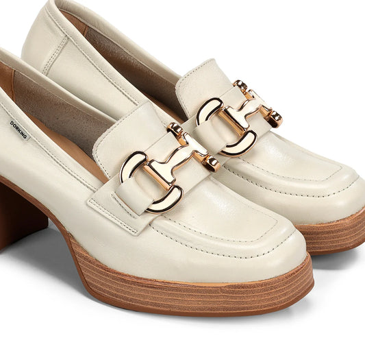 White loafers with gold buckles on a white background