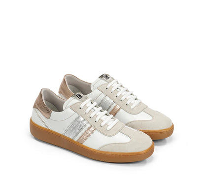 White sneakers with brown soles on a white background
