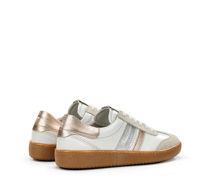 White sneakers with metallic accents on a white background