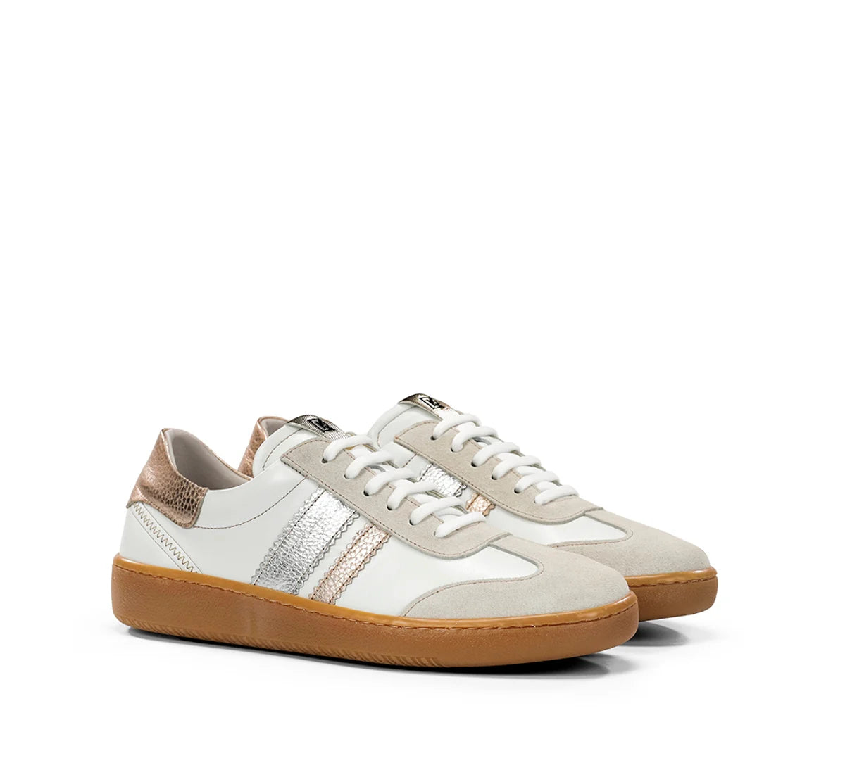 Pair of white sneakers with gum soles on a white background