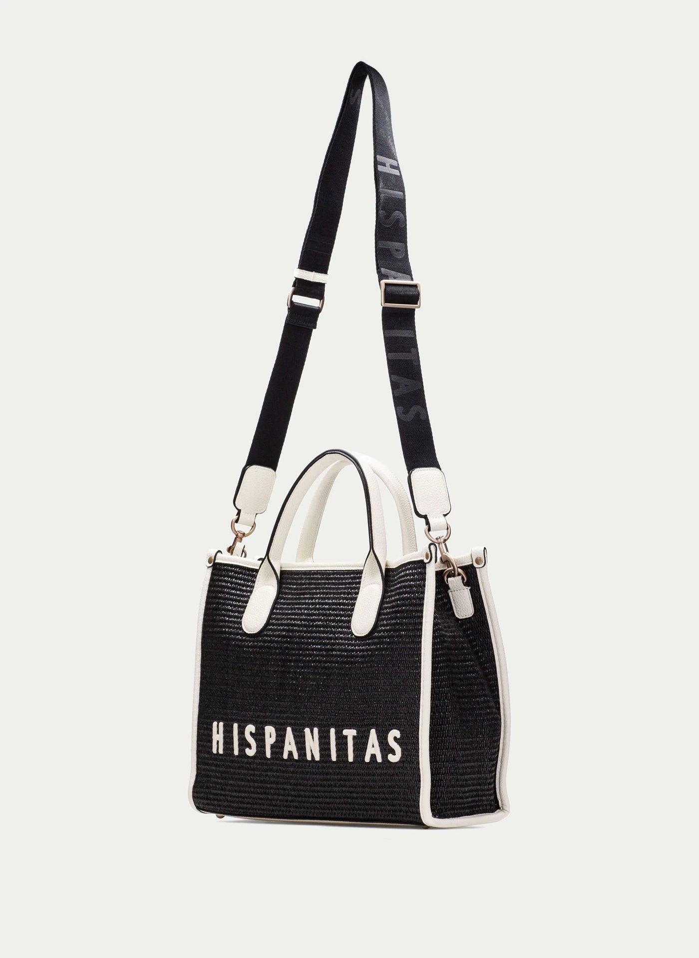 Black handbag with white text 'HISPANITAS' on a light gray background