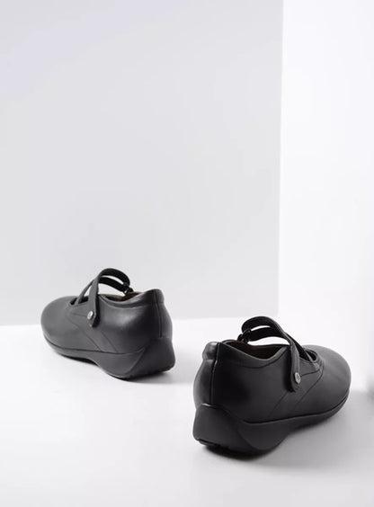 Pair of black dress shoes on a white background