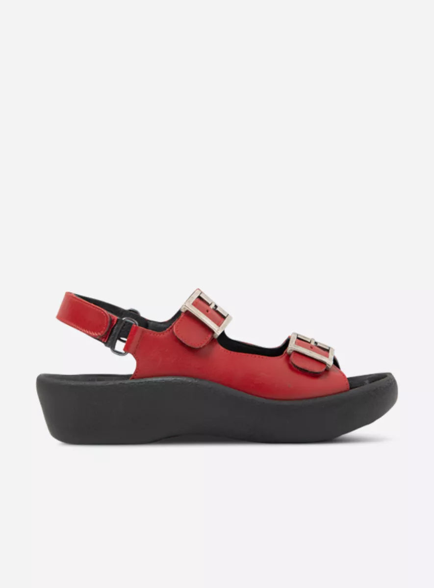 Red sandal with black sole on a white background