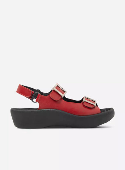 Red sandal with black sole on a white background