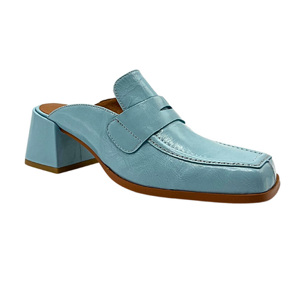 Side angle view of outside of a heeled mule with a loafer style front.  Closed toe