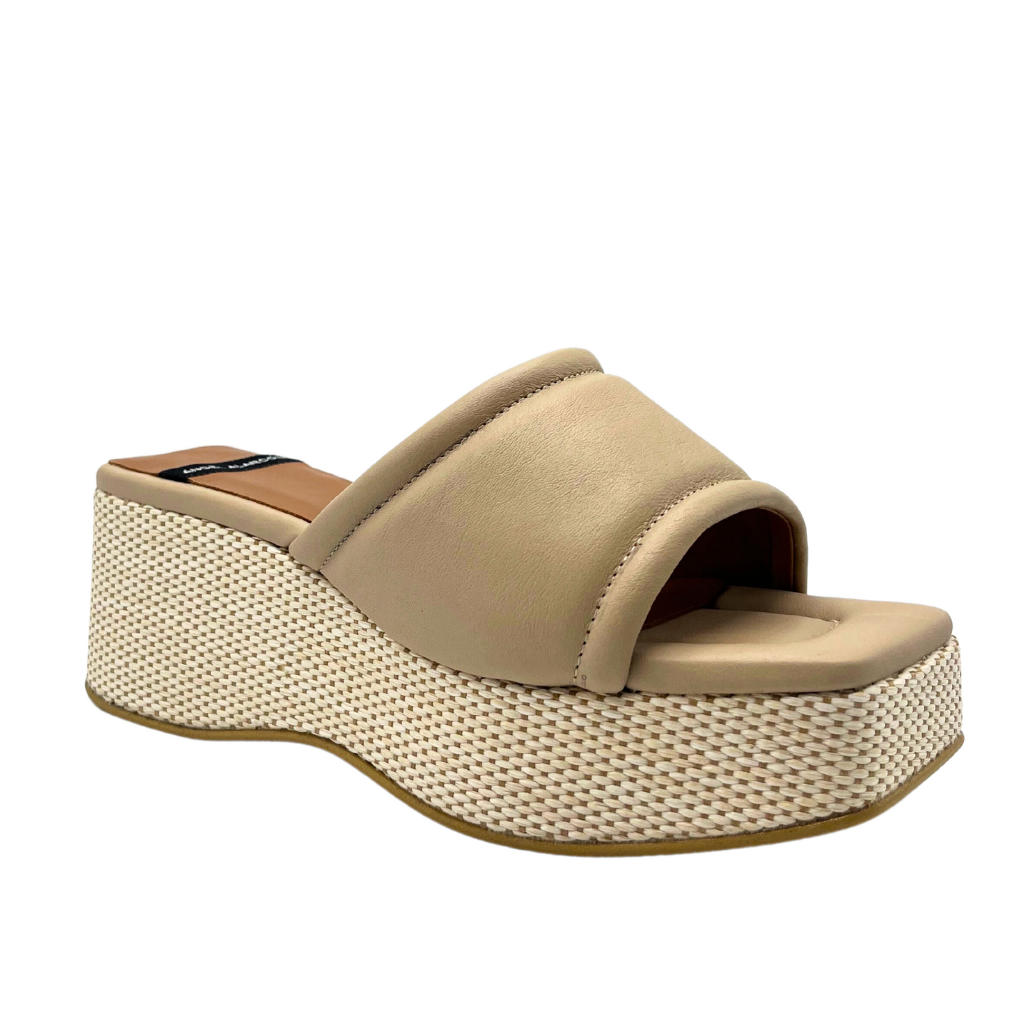 Side angle view of the Angel Alarcon Naomi in Dream Skin (ecru/tan).  Platform mule with light  weave detail on wedge which contrasts with smooth padded leather upper.