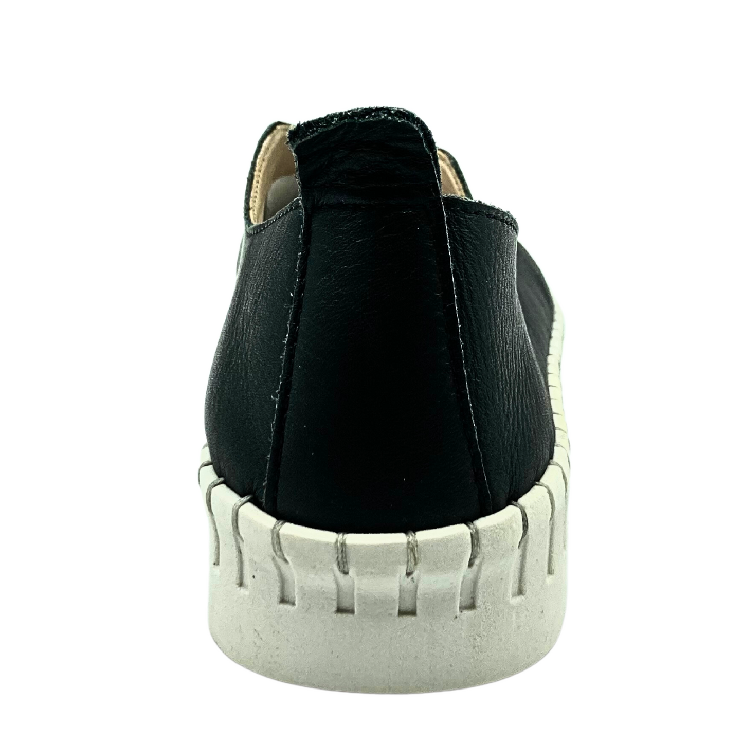 View from the back of the Ateliers Bindi slip on style sneaker in black leather.  Features a tab at heel for easier on/off