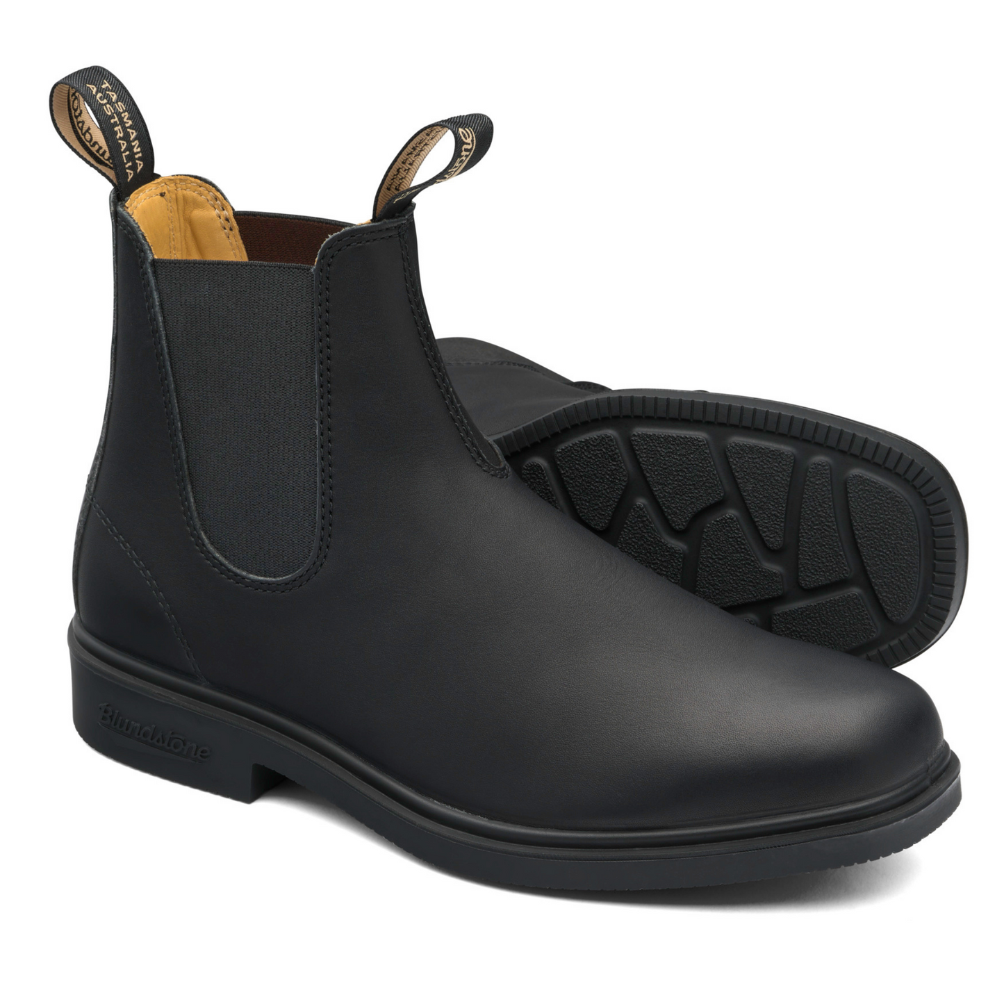 A pair of all black leather boots. Low heel, black sole with tan coloured interior lining.