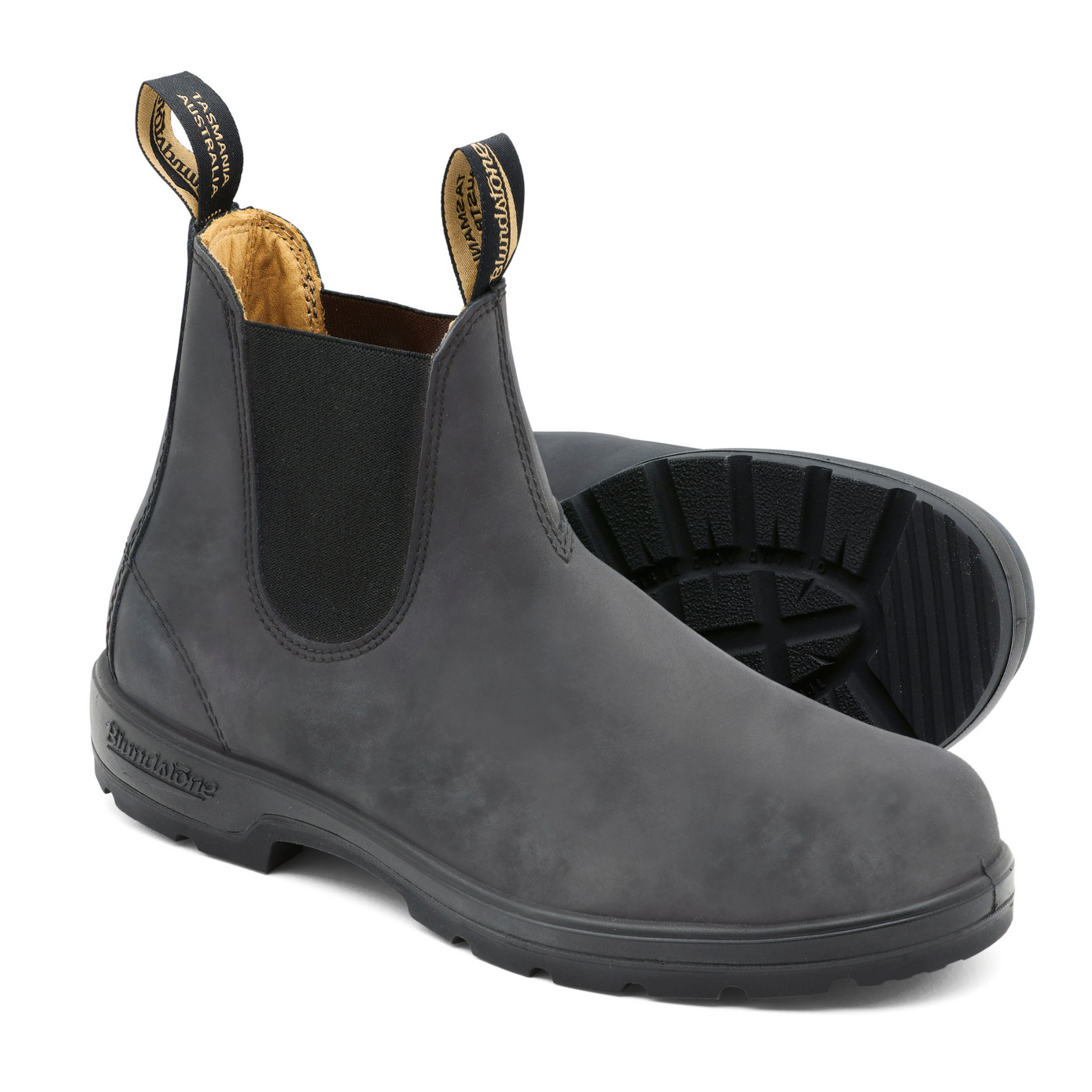 A pair of grey leather boots with tan coloured interior lining and black elastic sides.
