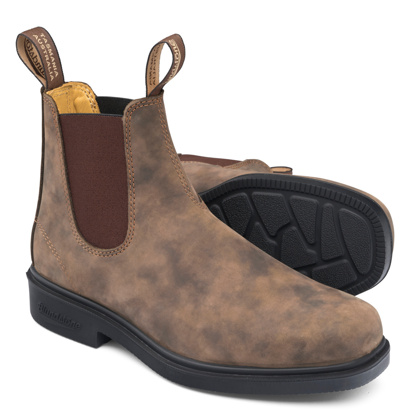 A pair of smokey, brown boots with tan coloured stitching and leather lined interior. Brown elastic sides. 