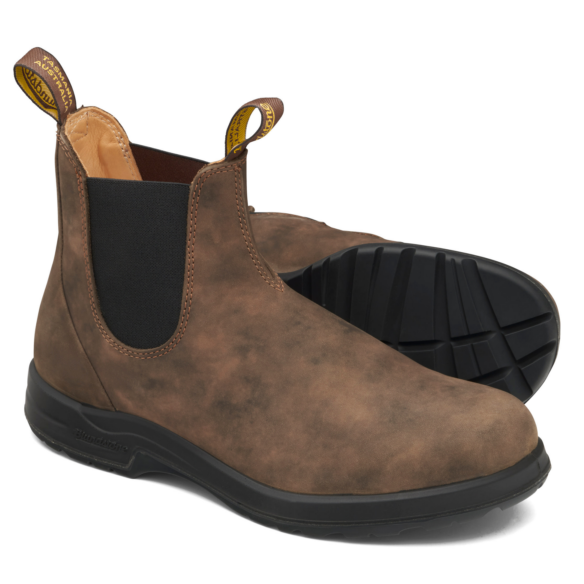 A pair of brown, leather boots with black soles and tan coloured leather interior lining.