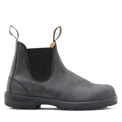 Side profile of the right shoe. Grey leather unisex boot with black sole. 