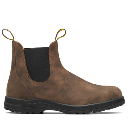 Side profile of the right boot. Rustic brown leather boot with black elastic sides