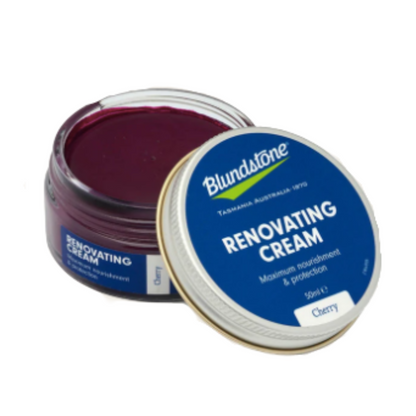 Open container of the cherry renovating cream. Metal lid leaning on the open jar.