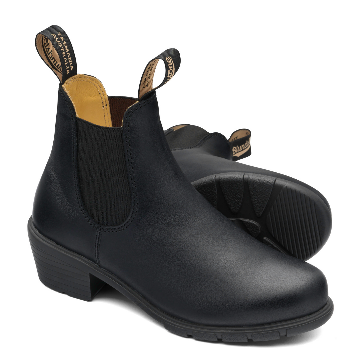 A pair of feminine, black leather, heeled boots with tanned colour interior lining.