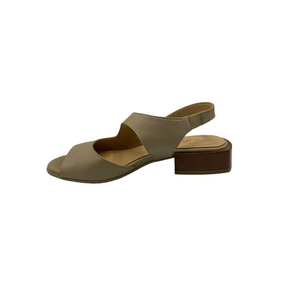 Inside view of slip on sandal in taupe.  Open toe and mid section.