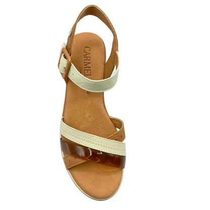 Top down view of neutral color sandal.  Three straps at the front in different shades and textures (tan, cream and brown lucite)