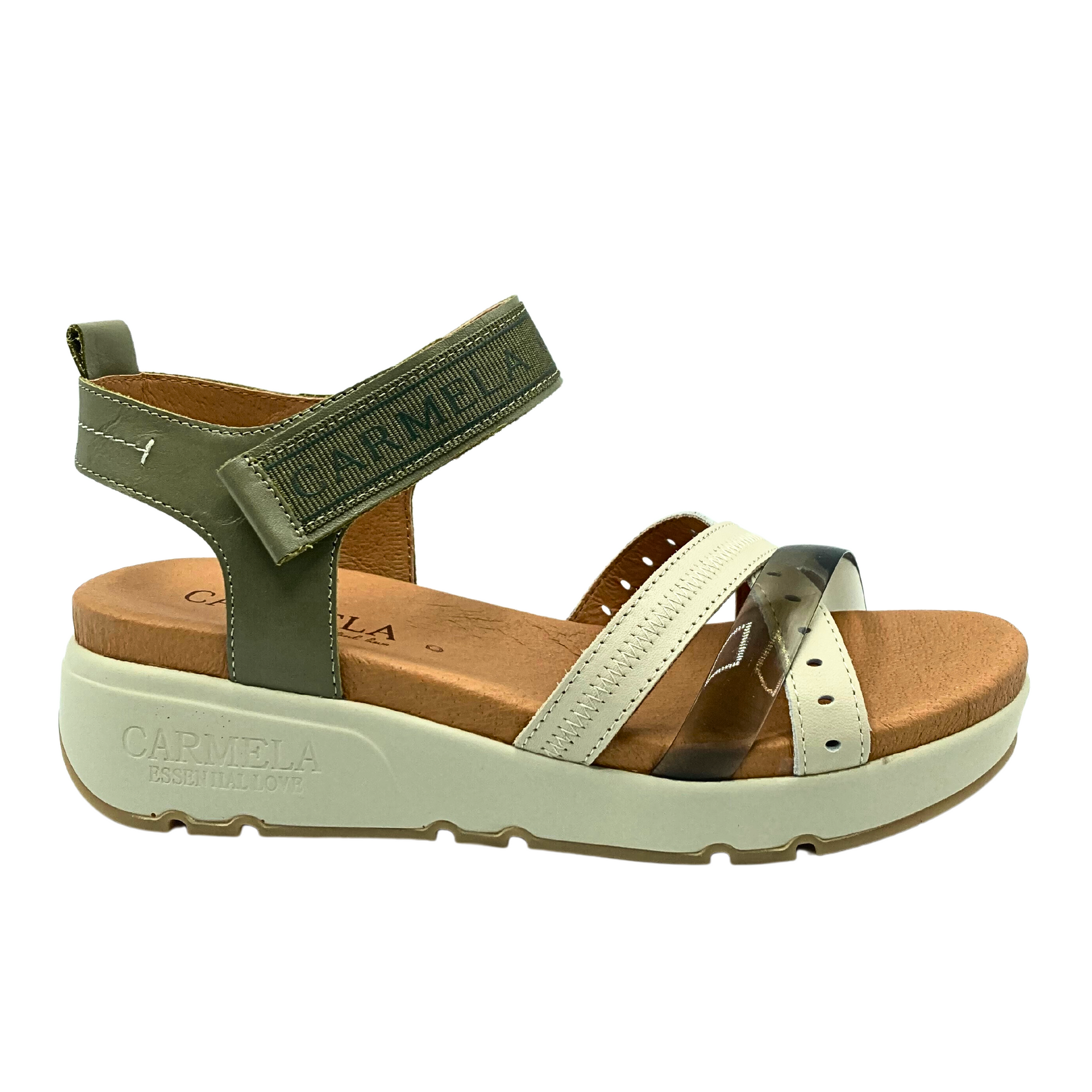 Outside view of wedge sandal by Carmela.  Combination of cream and khaki colors.  Open toe and heel with back and ankle strap.  Ankle strap has velcro adjustment