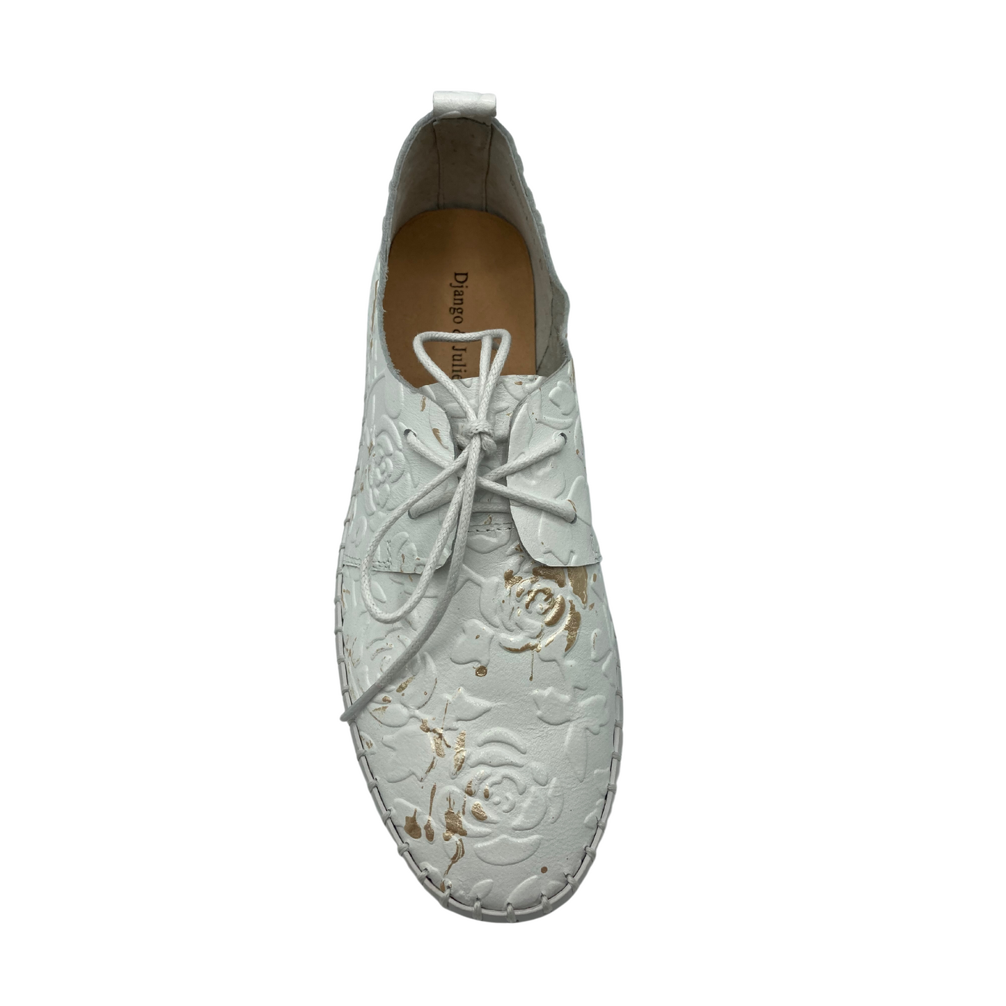 Top down view of a casual loafer that feels more like a sneaker.  Shown in white leather embossed with florals.  Laces in front