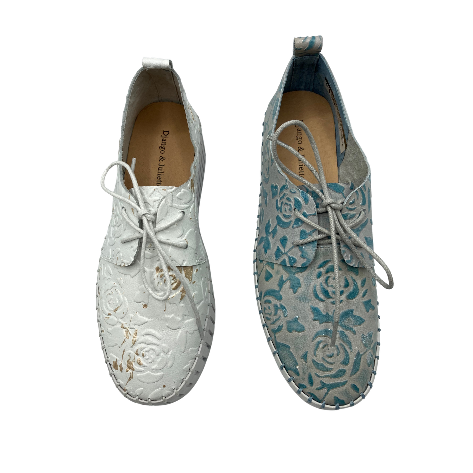 Top down view of unique sneaker/loafer style shoes.  Shown in white and a denim blue both with embossed flowers in the leather.