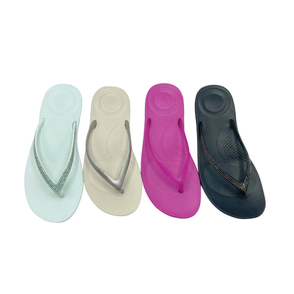 Top down view of the Fit Flop IQushion flip flop.  Shown in 4 colors - Sea foam blue, silver, miami violet, and black.