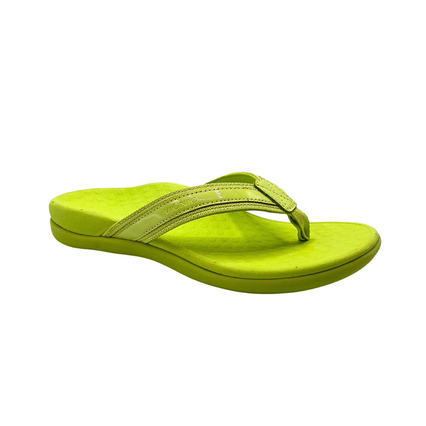 Angled side view of a flip flop sandal in a bright green.  Wide toe box and nicely contoured footbed