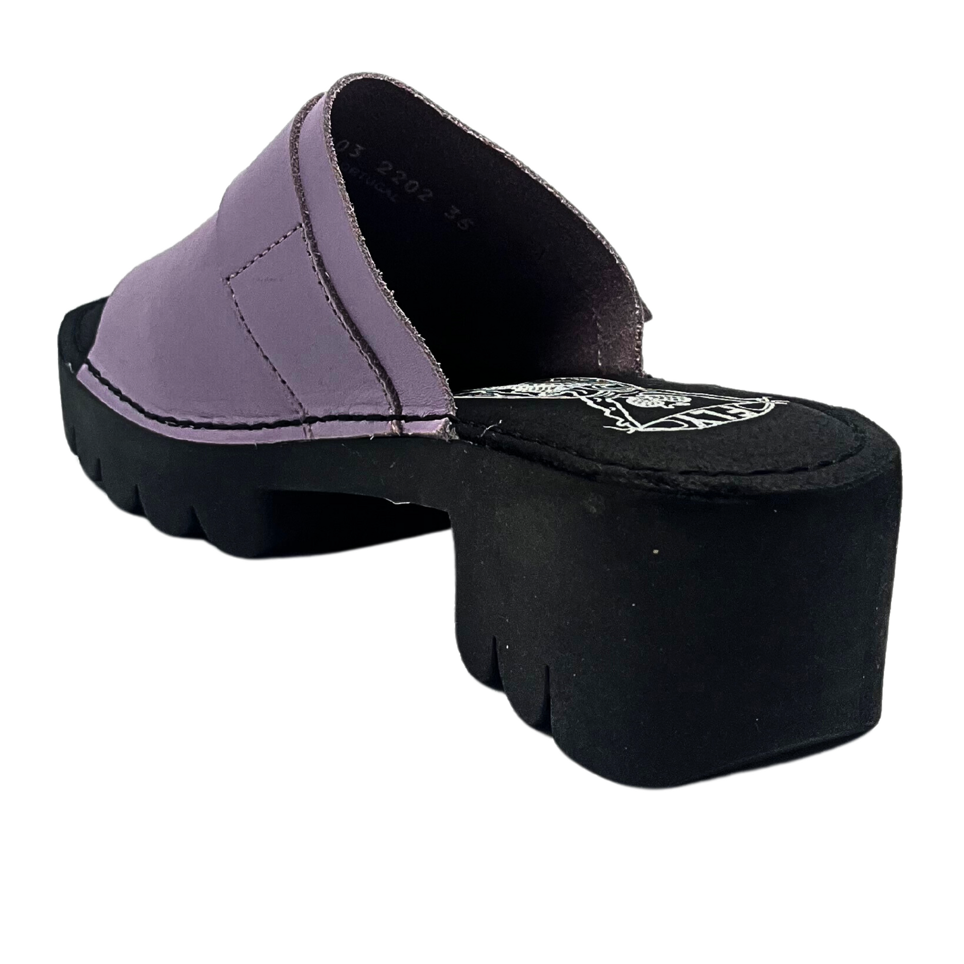 Rear view of mule sandal.  Chunky black sole with lilac leather upper