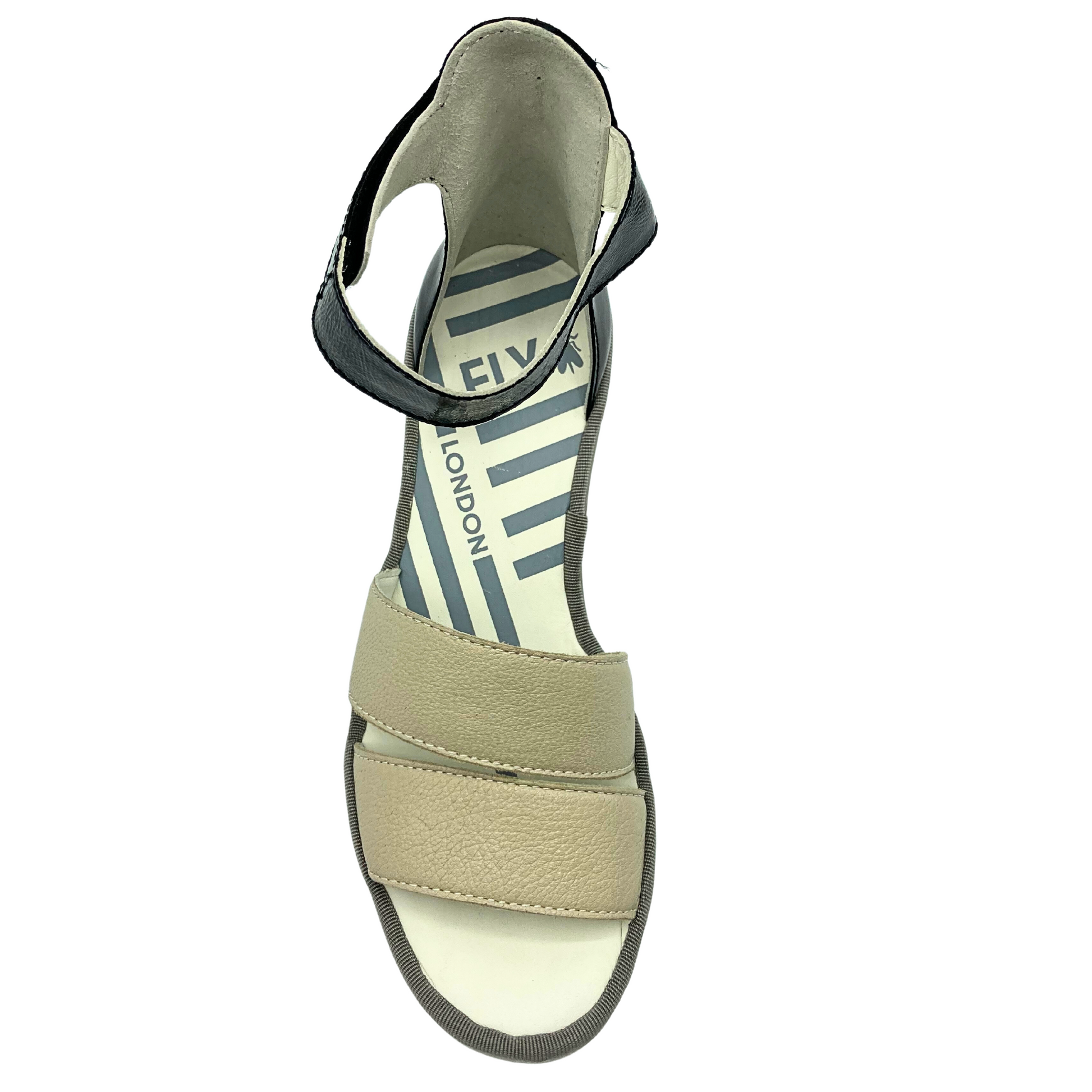 Top down view of two-tone sandal.  Open toe but closed in heel.  Velcro adjustment at ankle strap