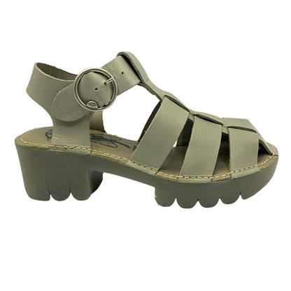 Outside view of a fisherman style sandal with a chunky rubber sole.  Color is called Cloud whichreads like a taupe/gray