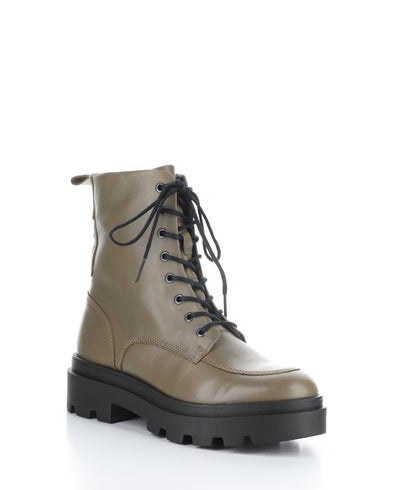 A right angle profile view of a taupe coloured, army style, boot is pictured. 