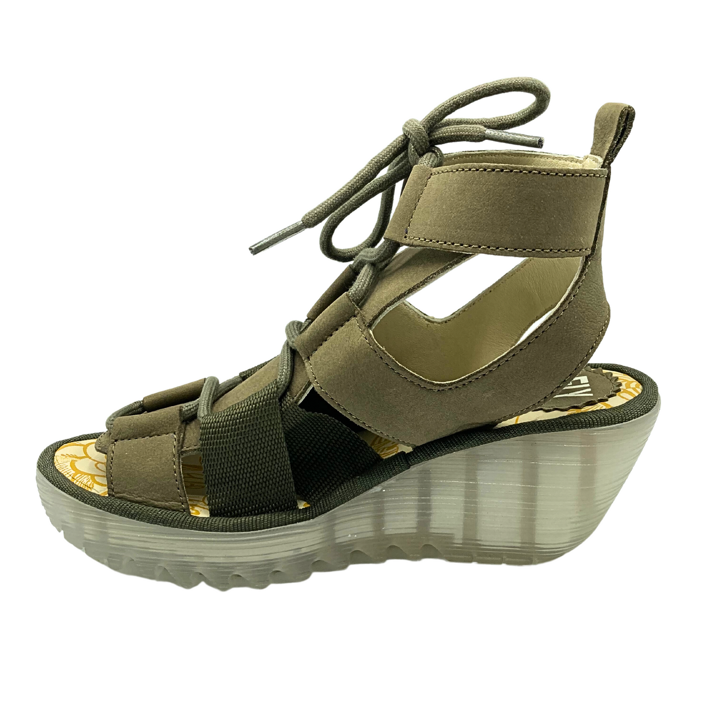 Inside view of Gladiator style sandal by Fly London called Yaca.  See through wedge sole, two-tone coloring in taupe/khaki
