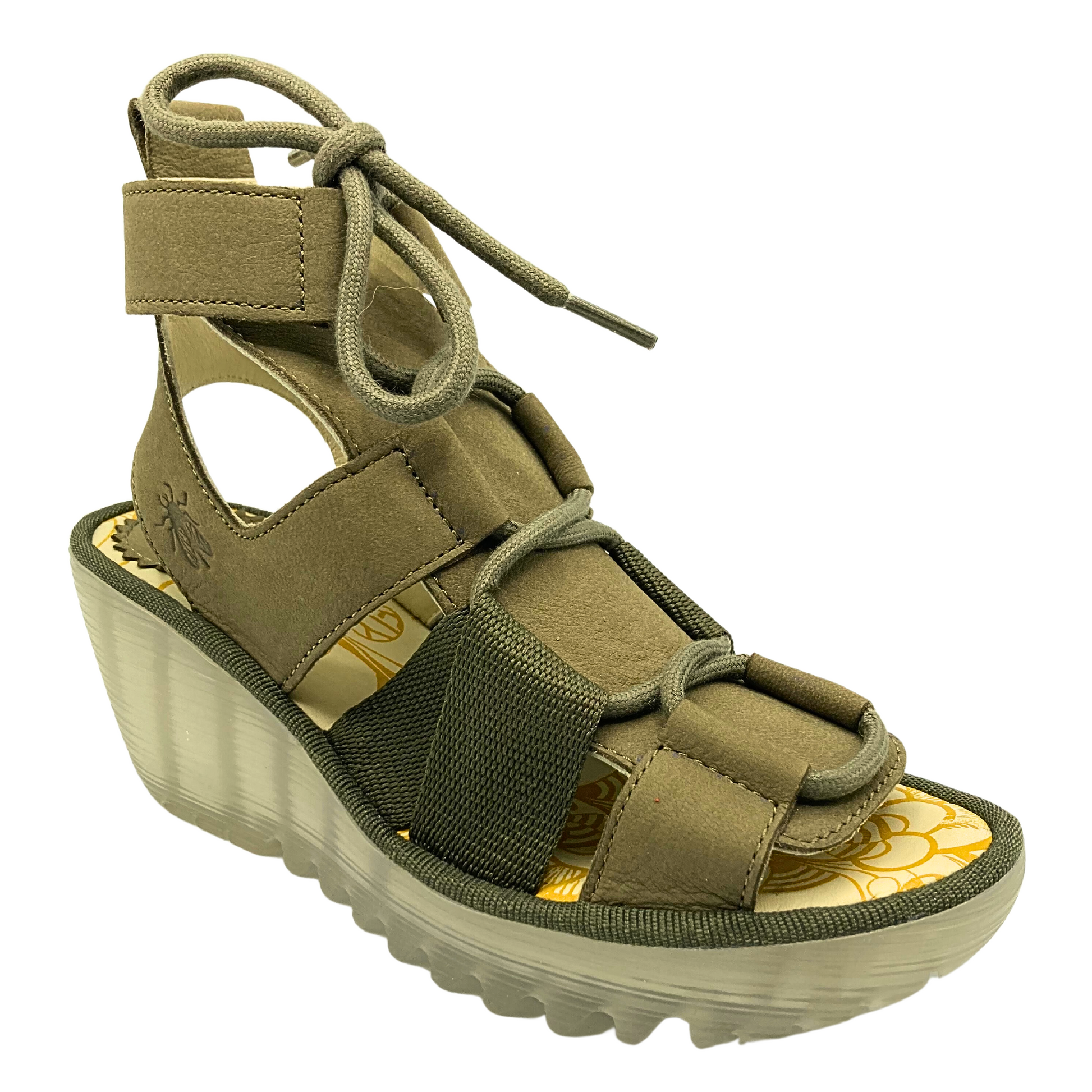 Angled front view of a classic Fly London sandal called Yaca.  Chunky see through wedge sole, and thick straps and laces