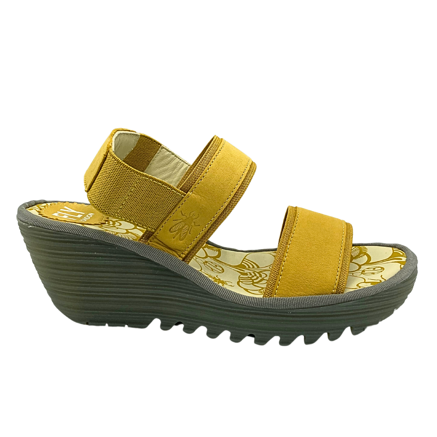 Outside view of a wedge sandal in a golden yellow color.  Slip on style with an elastic back strap and open toe