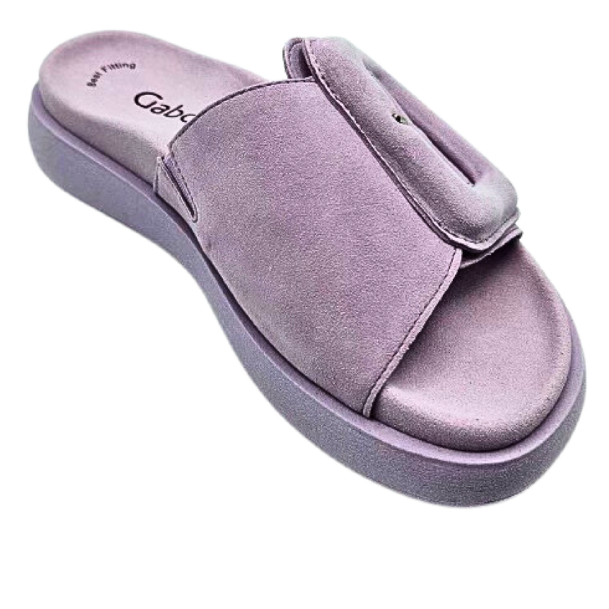 Angled shot of left shoe.  Shoe is a mule (open toe open back) so it is a slip on style.  Nicely contoured footbed for support.  Tone on tone in a lilac color so entire shoe looks as one