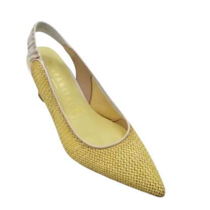 Angled side view of slip on slingback sandal.  Pointed toe. Shown in a buttery yellow