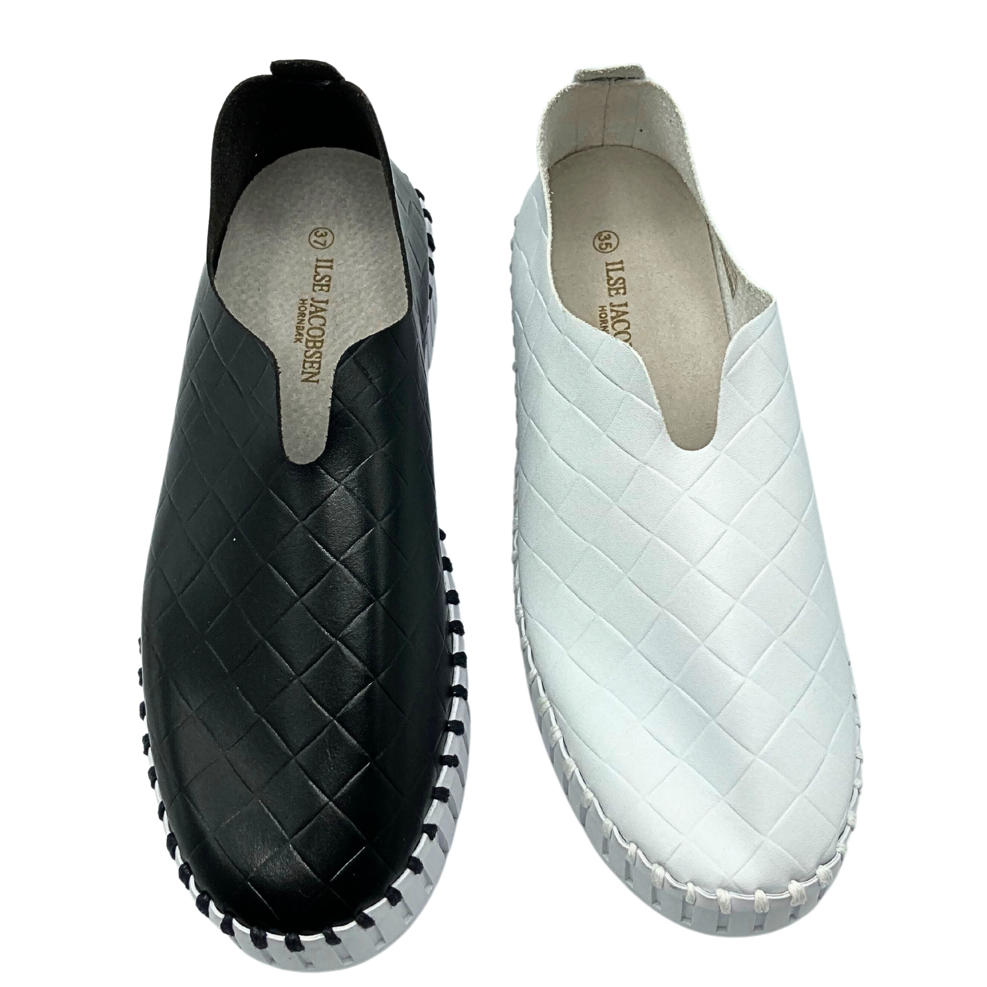 Top down view of slip on sneaker in black and white.  Leather lined on the inside and a man mande textile outside