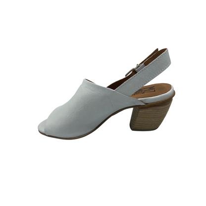 Inside view of a heeled sandal with open toe and back strap.  Full coverage leather upper in a cloud white