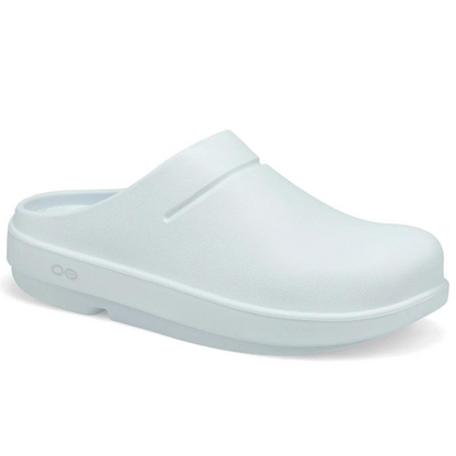 A matte white lightly textured clog is pictured at an angle. Showing the sole and the padding.