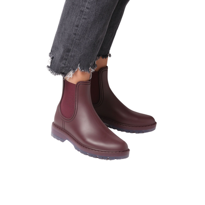 Side profile of a pair of Toni Pons Coney Boots in the colour Burgundy being styled by a model.