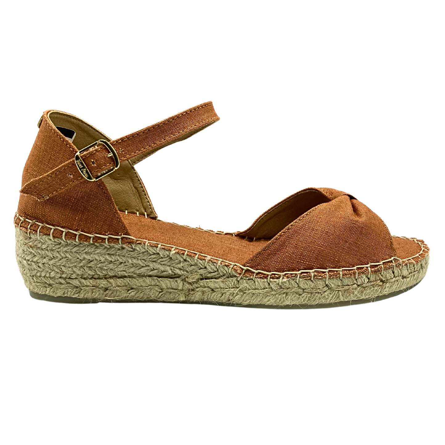 Outside view of espadrille sandal in a paprika color.  Low wedge heel in a woven rope.  Upper is a textile 