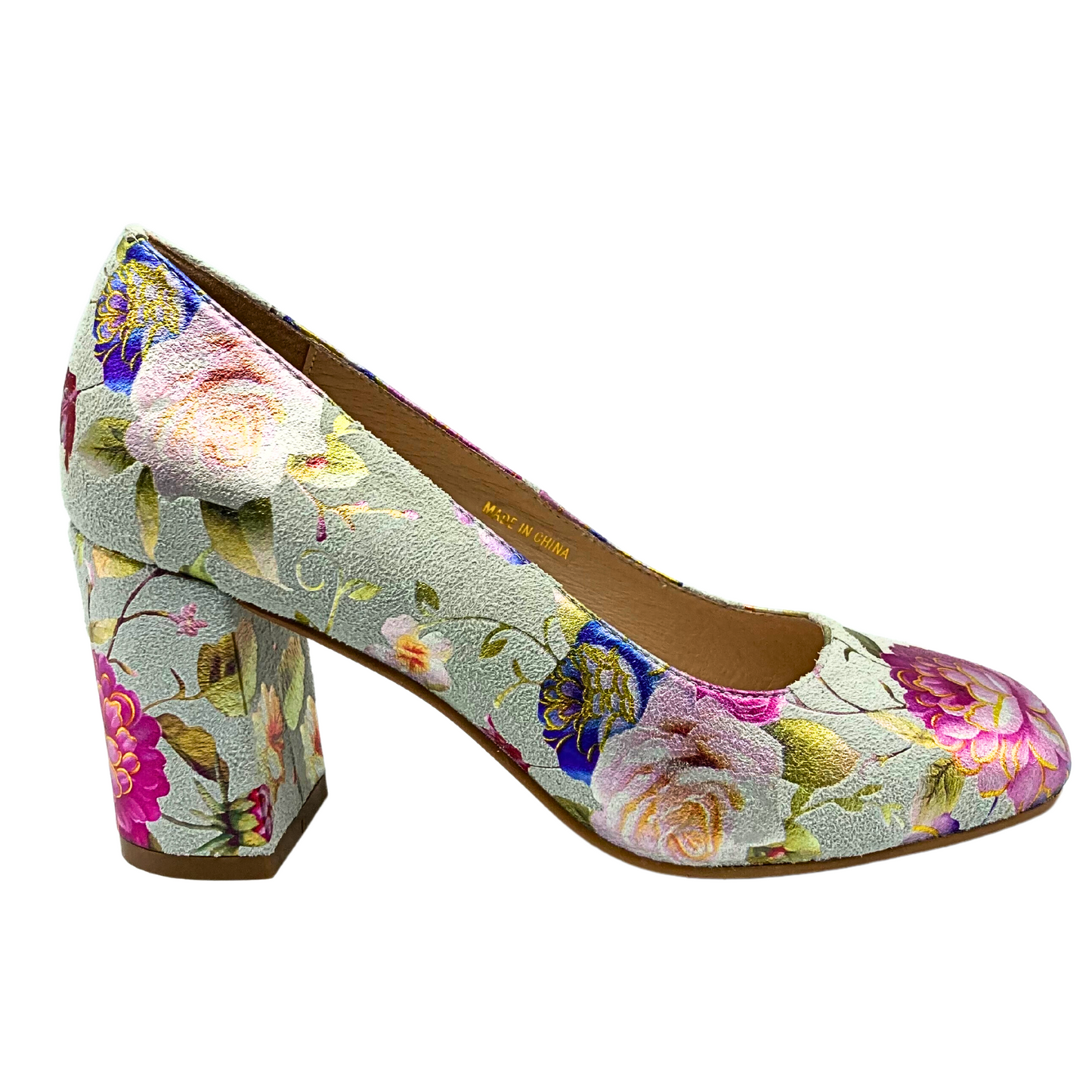 Outside view of a pump style shoe with a medium block heel.  Creamy base color leather with painted, soft floral details