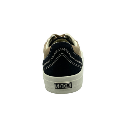 Rear view of right shoe.  Black/brown canvas with decorative stitching details.