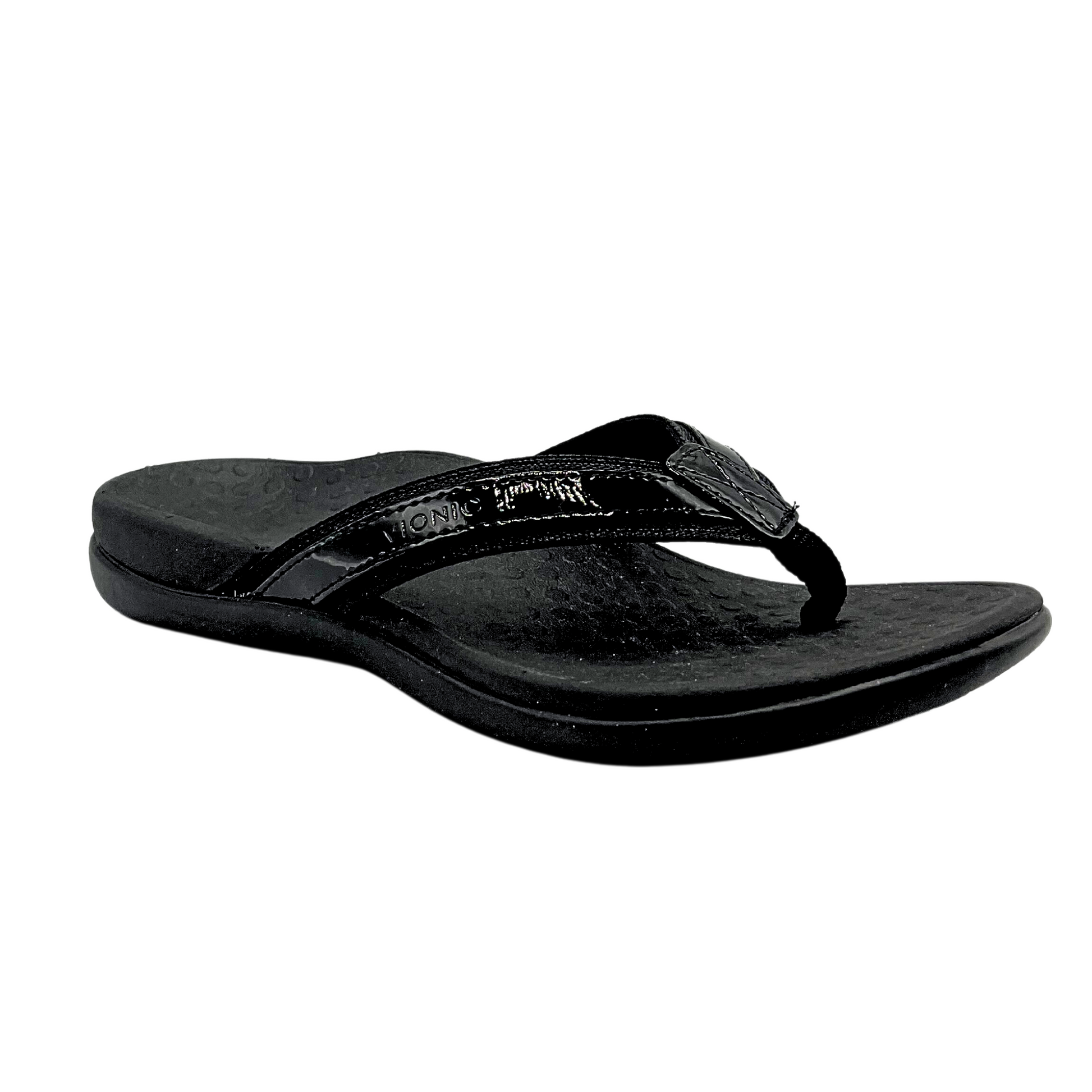 Outside view of a flip flop sandal in black.  Toe post and wide straps