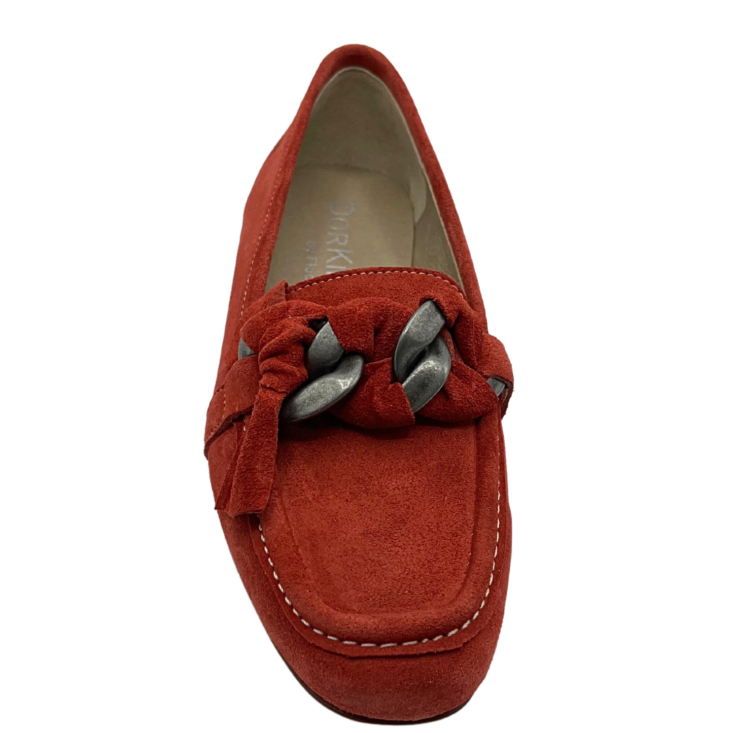 Top down view of terracotta suede slip on loafer.  Unique knotted leather around a metallic chain at top of foot