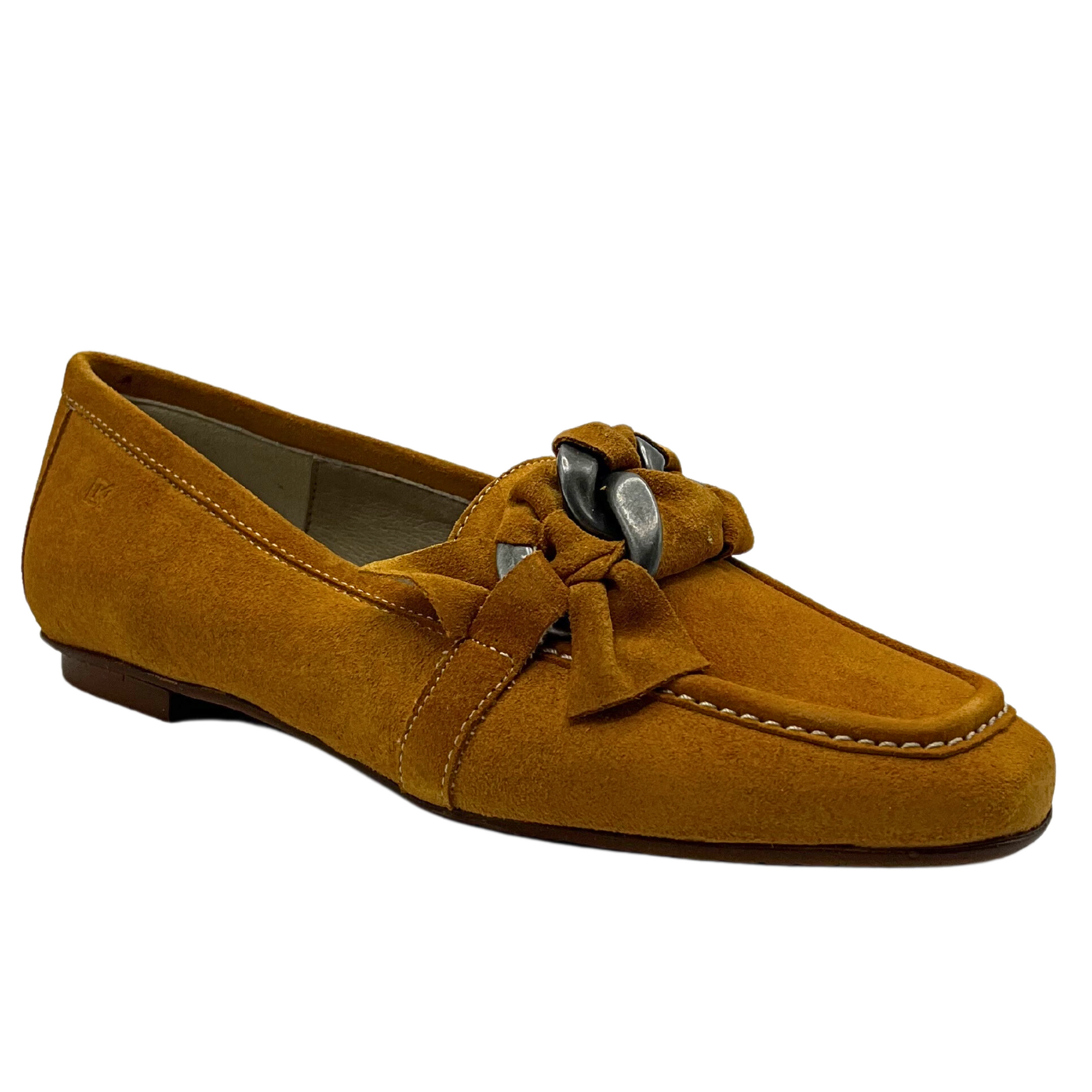 Angled side view of a moccasin style loafer done in a mustard suede.  Contrasting white stitching and knotted detail across teh top