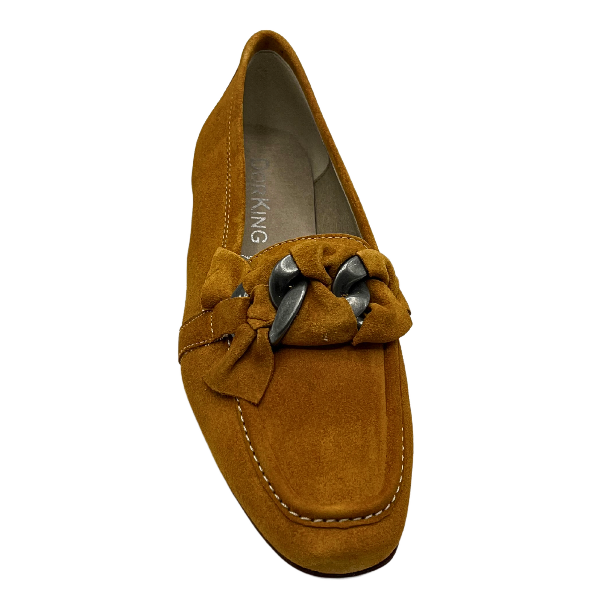 Top down view of a moccasin style slip on loafer.  Mustard suede with white stitching.  Across the top of foot is a knotted leather around a metallic chain