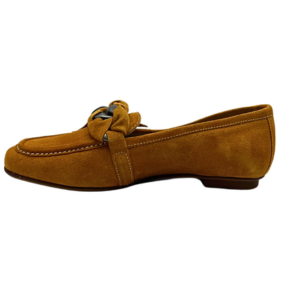 Inside view of a classic loafer in a mustard suede with contrasting white stitching