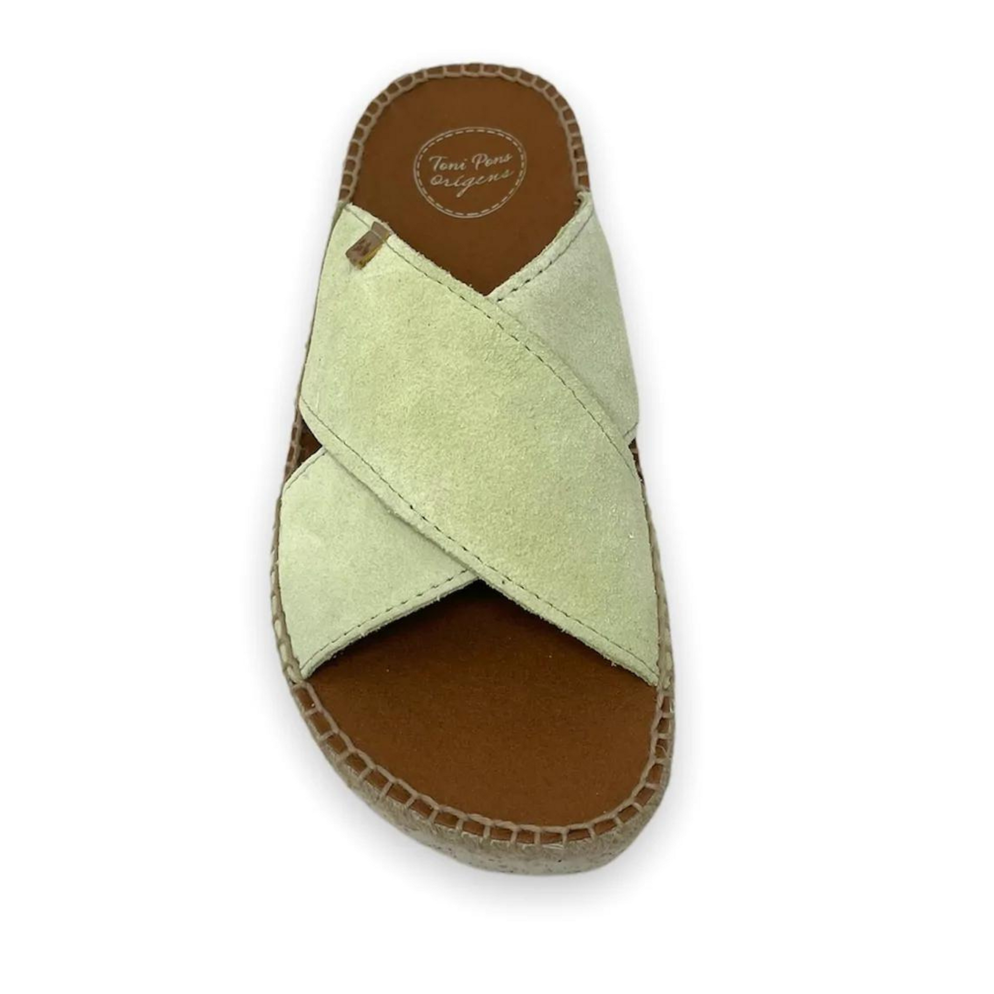A front view of the sandal in the lima colour, showing the crossed straps and the insole.