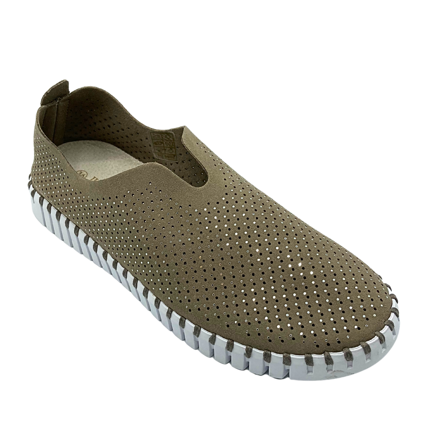 Angled side view of a slip on sneaker made of recycled microfibre.  It has tiny laser holes and crystals throughout and a white sole.  Pictured in a taupe color called Falcon.